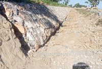 Foto:Proyek rehabilitasi sungai yang berdiri di desa Jambu, Kecamatan Lenteng