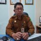 KANTOR: Kepala Dinas Kependudukan dan Ke pencatatan Sipil (Disdukcapil) Sumenep, Raden Achmad Syahwan Effendy, saat ditemui di ruang kerjanya (Sandi - Seputar Jatim)