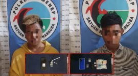MENUNDUK: Dua warga Prenduan, Pragaan, yang ditangkap Polres Sumenep atas dugaan penyalahgunaan Narkoba