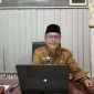 BERKACAMATA: Kepala Dinsos Sumenep, Abd. Rahman Riadi, saat ditemui di ruang kerjanya (Doc. Seputar Jatim)