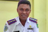 TERSENYUM: Kepala Dinas Perikanan Kabupaten Sumenep, Agustiono Sulasno.