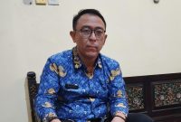 BERKACAMATA : Kabid Perlindungan dan Jaminan Sosial (Linjamsos) Sumenep, Erwin Hendra saat ditemui di ruang kerjanya (SandiGT - Seputar Jatim)