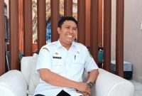 TERSENYUM: Kepala Disnaker Sumenep, Heru Susanto (Doc. Seputar Jatim)