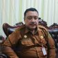 GAGAH : Kepala Bakesbangpol Sumenep, Dzulkarnaim saat ditemui wartawan di ruangannya (SandiGT - Seputar Jatim)