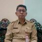 BERDINAS: Kadisdukcapil Sumenep, Syahwan Effendi, saat ditemui di ruangannya (SandiGT - Seputar Jatim) 