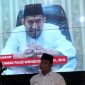 VIDEOTRON: Bupati Sumenep, Achmad Fauzi Wongsojudo saat memberikan sambutan secara virtual pada acara Deklarasi Gerakan Bahaya Judi Online di Aula Kominfo Sumenep (Doc. Seputar Jatim)