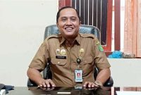 TERSENYUM: Kepala Bapenda Sumenep, Faruk Hanafi, saat menyampaikan tentang capaian PAD yang melampaui target (Doc. Seputar Jatim)
