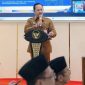 BERDIRI: Kepala Bappeda Kabupaten Sumenep, Arif Firmanto, saat menyampaikan arah pembangunan daerah 2026 (SandiGT - Seputar Jatim)
