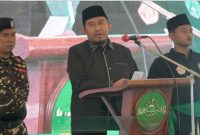 TEGAS: Bupati Sumenep, Achmad Fauzi Wongsojudo saat memberikan sambutan dalam acara Pelantikan PCNU Sumenep Masa Khidmat 2026–2031 di Pondok Pesantren Al-Karimiyyah Braji, Sumenep (Doc. Seputar Jatim)