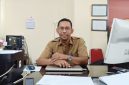 TERSENYUM: Sekretaris Disperkimhub Sumenep, Agus Adi Hidayat (Foto Istimewa)